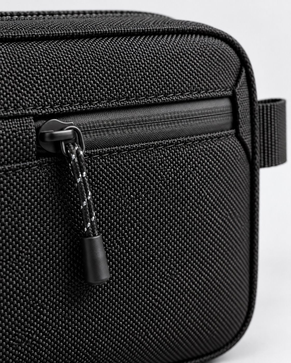 Fictional FIRSTSTACHE black pouch concept, zipper and stitching detail